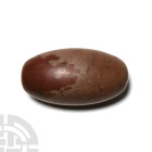 Large Bactrian Polished Weight
3rd-2nd millennium B.C. A large capsule-shaped polished stone weight. 4.44 kg, 21.5 cm (8 1/2 in.). Acquired in the 19...