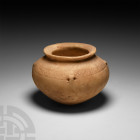 Mesopotamian Alabaster Vessel
3rd millennium B.C. An alabaster bowl with flat rim undercut to the underside; sloping shoulder engraved with band of c...