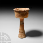 Bactrian Alabaster Chalice
Late 3rd-early 2nd millennium B.C. A veined alabaster chalice with squat, barrel-shaped bowl, everted rim and tapering cyl...