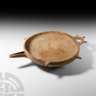 Amlash Spouted Terracotta Vessel
2nd-1st millennium B.C. An extremely well-preserved terracotta spouted bowl with a flattened base, deep hemispherica...