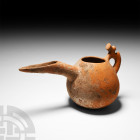 Amlash Terracotta Vessel
2nd-1st millennium B.C. A finely modelled, orange-reddish terracotta vessel comprising a squat, oval body rising from a flat...