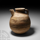 Western Asiatic Spouted Jar with Birds
3rd-2nd millennium B.C. A ceramic jar with drum-shaped body, short spout to the shoulder, trumpet-shaped mouth...