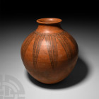 Large Western Asiatic Storage Vessel
2nd millennium B.C. A large ceramic storage jar with bulbous body and broad neck with everted rim, decorated aro...