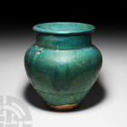 Western Asiatic Blue-Glazed Jar
Circa 13th century A.D. A piriform earthenware jar with broad neck, decorated with a blue glaze; restored. 2.96 kg, 2...