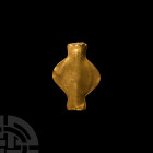 Western Asiatic Gold Butterfly Pendant
2nd-1st millennium B.C. A sheet-gold 'butterfly' bead of hollow construction. 5.16 grams, 35 mm (1 3/8 in.). A...
