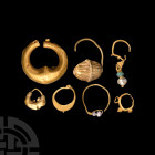 Western Asiatic Gold Earring Group
Late 1st millennium B.C.-early 1st millennium A.D. A mixed group of seven gold hoop earrings comprising: an exampl...