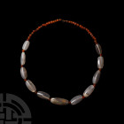 Western Asiatic Carnelian and Agate Bead String
1st millennium B.C. or later. A restrung necklace composed of double drilled oval agate beads from th...