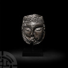 Ilkhanid Silver Mask with Inscription
13th-early 14th century A.D. A sheet-silver mohra devotional mask with a convex upper face, likely representing...