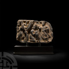 Gandharan Schist Relief Fragment with Buddha and Priests
Circa 2nd-3rd century A.D. A grey schist relief fragment of roughly rectangular form, depict...