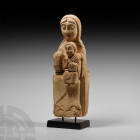 Medieval Madonna and Child Statue
16th century A.D. A carved volcanic tuff figurine of Mary sitting with the infant Jesus on her lap; Mary with an or...