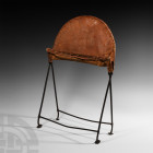 Ethiopian Manuscript Lectern
15th-16th century A.D. A portable folding wrought iron-framed lectern with leather back and ledge. 1.6 kg, 64 cm high (2...