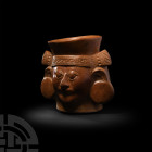 Pre-Columbian Moche Head Vessel of a Lord
Circa 3rd-6th century A.D. A ceramic cup in the form of a male head, modelled wearing a headdress with geom...