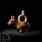 Prehispanic Fine Moche Llama Stirrup Vessel
1st-6th century A.D. A bichrome ceramic stirrup vessel in the form of a llama, modelled standing with sty...