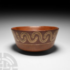 Pre-Columbian Nazca Snake Bowl
1st century B.C.-7th century A.D. A bell-shaped vessel with a rounded base and polychrome zoomorphic frieze displaying...