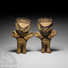 Pre-Columbian Chancay Figurine Pair
10th-14th century A.D. A pair of ceramic figures, each modelled standing with stub arms outstretched, wearing pie...