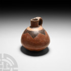 Pre-Columbian Geometric Jug
16th century A.D. or earlier. A carinated ceramic juglet with integral handle and polychrome geometric design to the shou...