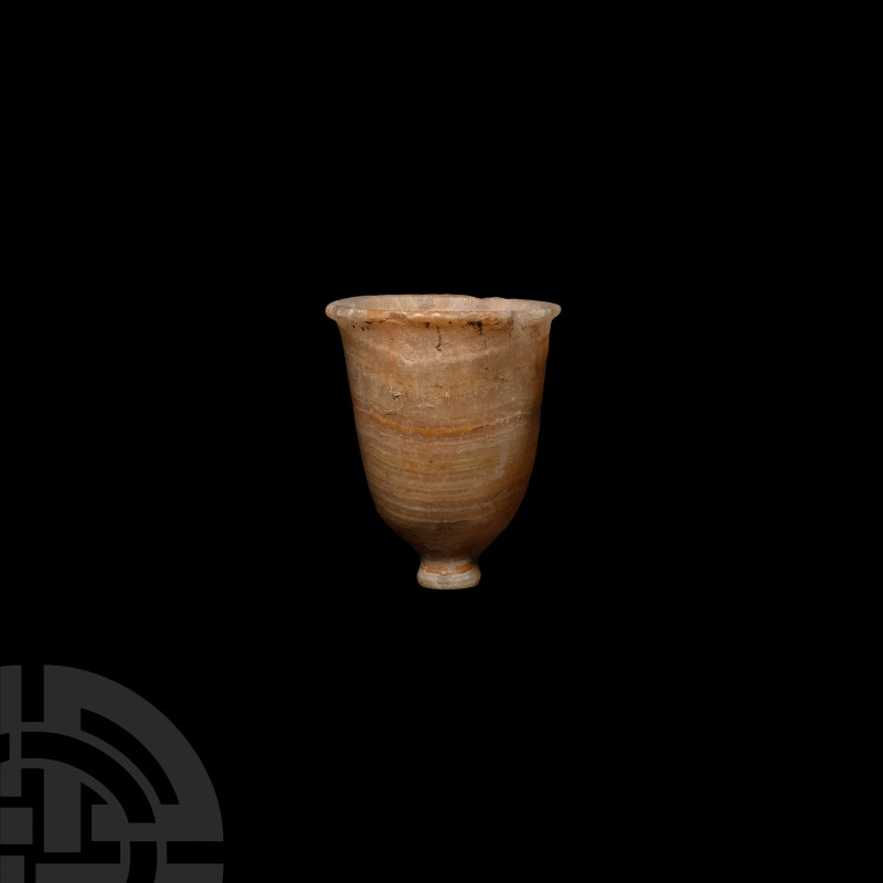 Egyptian Veined Alabaster Footed Cup
1st millennium B.C. or earlier. A piriform...