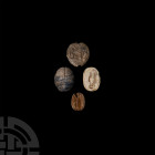 Egyptian Scarab Collection
New Kingdom-Ptolemaic Period, 1550-30 B.C. A group of four scarabs and a scaraboid seals, comprising: a lapis lazuli scara...