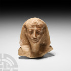 Egyptian Style Head of a Pharaoh
19th-20th century A.D. A carved alabaster head of a pharaoh wearing a ribbed nemes headdress with ornate uraeus. 2.3...