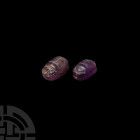 Egyptian Amethyst Scarab Group
Graeco-Roman Period, 332 B.C.-323 A.D. A group of two carved amethyst scarabs, each with detailed carapace and plain u...