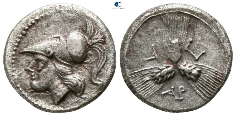 Apulia. Arpi 215-212 BC. 
Triobol AR

13mm., 2,01g.

Head of Athena left, w...