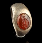 Roman Silver Ring With Carnelian Intaglio
1st-3rd century CE
Silver, Carnelian, 23 mm overall, 18 mm internal diameter, 9,15 g
Intact and wearable....