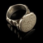 Ottoman Silver Ring
15th/16th century CE
Silver, 34 mm overall, 20 mm internal diameter, 31,82 g
Very heavy silver ring with floral ornament on rin...