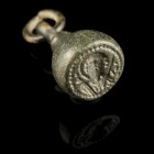 Byzantine seal stamp
10th-12th century CE
Bronze, 27 mm, 8,54 g
Intact stamp showing a male bust (Demetrios?) frontal.
Very fine conditon. Rare!
...