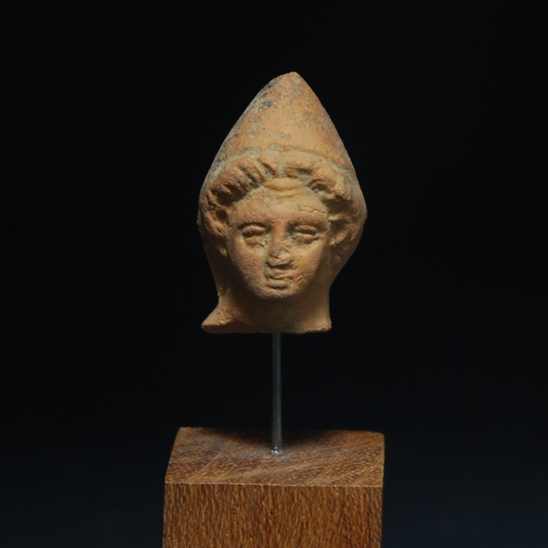 Roman Terracotta Head
2nd century CE
Terracotta, 34 mm
Head of a child wearin...