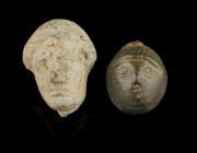 Roman Heads
2nd-4th century CE
Lead, Bronze, 32-24 mm
Lot of two heads.
Fine condition.
Ex. Coll. M.C., acquired at the european art market.
