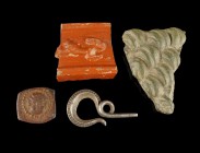 Miscellaneous
2nd-4th century CE
Bronze, Silver, Pottery, 34-14 mm
Lot existing of a sigillata shard, a silver decoration piece, a mount showing a ...