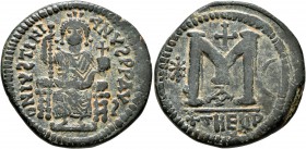 Justinian I, 527-565. Follis (Bronze, 32 mm, 16.52 g, 6 h), Theoupolis (Antiochia). D N IV S TINIANV S P P AV S Justinian enthroned facing, holding lo...