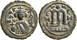 ISLAMIC, Umayyad Caliphate. temp. Mu'awiya I ibn Abi Sufyan , AH 41-60 / AD 661-680. Fals (Bronze, 20 mm, 4.29 g, 6 h), Arab-Byzantine type, Hims. K/A...