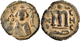 ISLAMIC, Umayyad Caliphate. temp. Mu'awiya I ibn Abi Sufyan , AH 41-60 / AD 661-680. Fals (Bronze, 20 mm, 4.24 g, 7 h), Arab-Byzantine type, Hims. K/A...