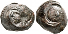 SEALS, Roman. Seal (Lead, 11 mm, 7.67 g), 1st-3rd century AD. Helmeted male head to left. Rev. Shield (?). A curiously thick seal. Very fine.