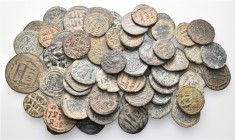A lot containing 59 bronze coins. Includes: Judean, Arabo-Byzantine and Islamic coins. Fine to very fine. LOT SOLD AS IS, NO RETURNS. 59 coins in lot.