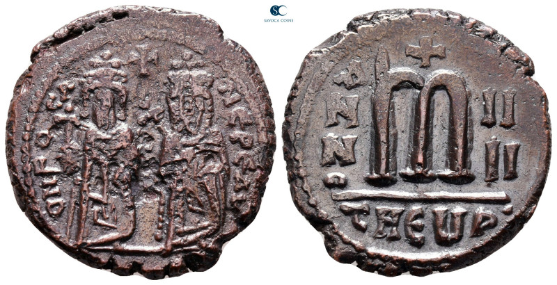 Phocas, with Leontia AD 602-610. Theoupolis (Antioch)
Follis or 40 Nummi Æ

2...