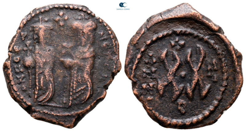 Phocas, with Leontia AD 602-610. Theoupolis (Antioch)
Half Follis or 20 Nummi Æ...