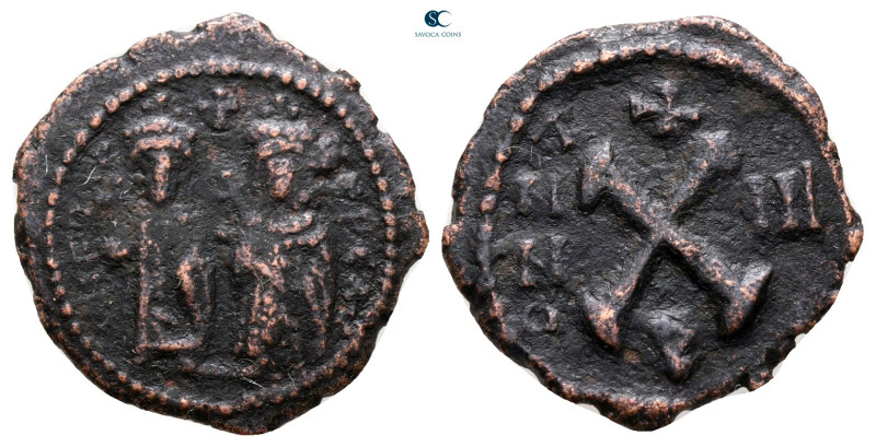 Phocas, with Leontia AD 602-610. Theoupolis (Antioch)
Decanummium Æ

17 mm, 1...