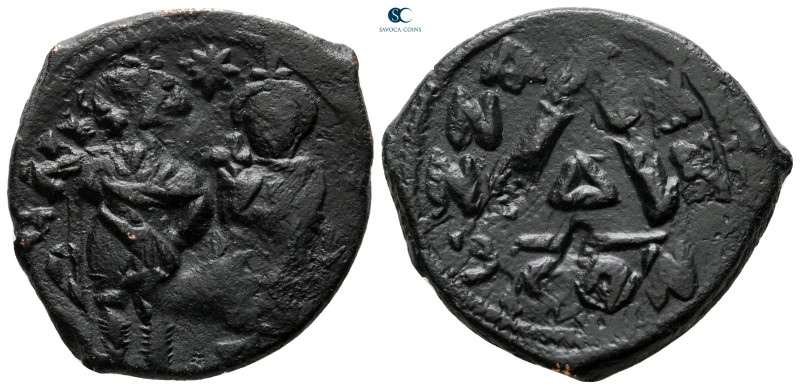 Heraclius with Heraclius Constantine AD 610-641. Constantinople
3/4 Nummus Æ
...