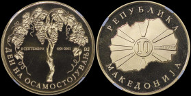 NORTH MACEDONIA: 10 Denari (2001) in gold (0,916) commemorating the 10th Anniversary of Indepedence. Value in circle within radiant map on obverse. Gr...