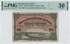 GERMAN EAST AFRICA: 10 Rupien (15.6.1905) in black on red unpt. Dar es Salem Harbor at lower center on face. S/N: "34648". Printed by G&D. Inside hold...