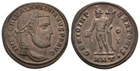 IMPERIO ROMANO. GALERIO. Follis. Antioquía (309). A/ Cabeza laureada a der.; IMP C GAL VAL MAXIMIANVS P F AVG. R/ Genio a izq. con pátera y cornucopia...