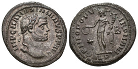 IMPERIO ROMANO. MAXIMIANO. Follis. Alejandría (295). A/ Cabeza laureada a der.; IMP C M A MAXIMIANVS P F AVG. R/ Genio a izq. con pátera y cornucopia;...