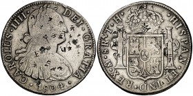 1804. Carlos IV. México. TH. 8 reales. (Cal. 701 var). 26,29 g. Resellos orientales. Limpiada. (MBC).