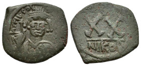 Tiberius II Constantine (578-582). Æ 20 Nummi (23mm, 6.70g). Nicomedia, c. 579-582. Crowned and cuirassed bust facing, holding globus cruciger and shi...