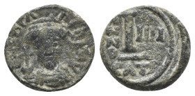 Phocas (602-610). Æ 10 Nummi (14mm, 2.67g, 6h). Catania, year 4 (605/6). Crowned and cuirassed facing bust, holding globus cruciger and shield. R/ Lar...
