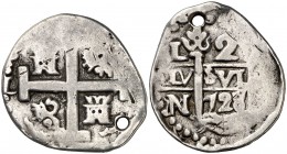 1728/7. Felipe V. Lima. N/M. 2 reales. (Cal. 1217 var). 5,49 g. Acuñada sobre 2 reales de Luis I. Perforación. Muy rara. (MBC-).