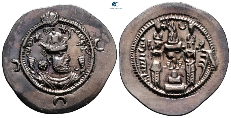 Sasanian Kingdom. Khusro I AD 531-579. 
Drachm AR

30 mm, 4,07 g

Crowned b...