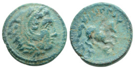 Kingdom of Macedon, Philip II Æ Circa 359-336 BC. Head of Herakles to right, wearing lion skin 
headdress / ΦΙΛΙΠΠΟΥ, warrior on horse rearing to righ...
